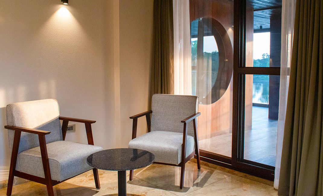 Balcony seating area overlooking the lake at Lakeside Manor