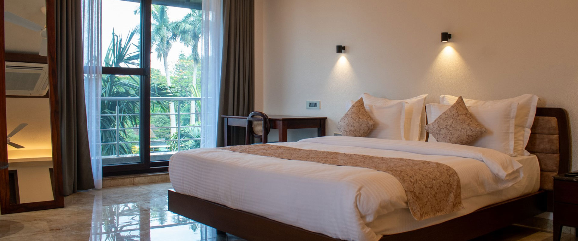 Spacious guest room with king bed and balcony at Lakeside Manor